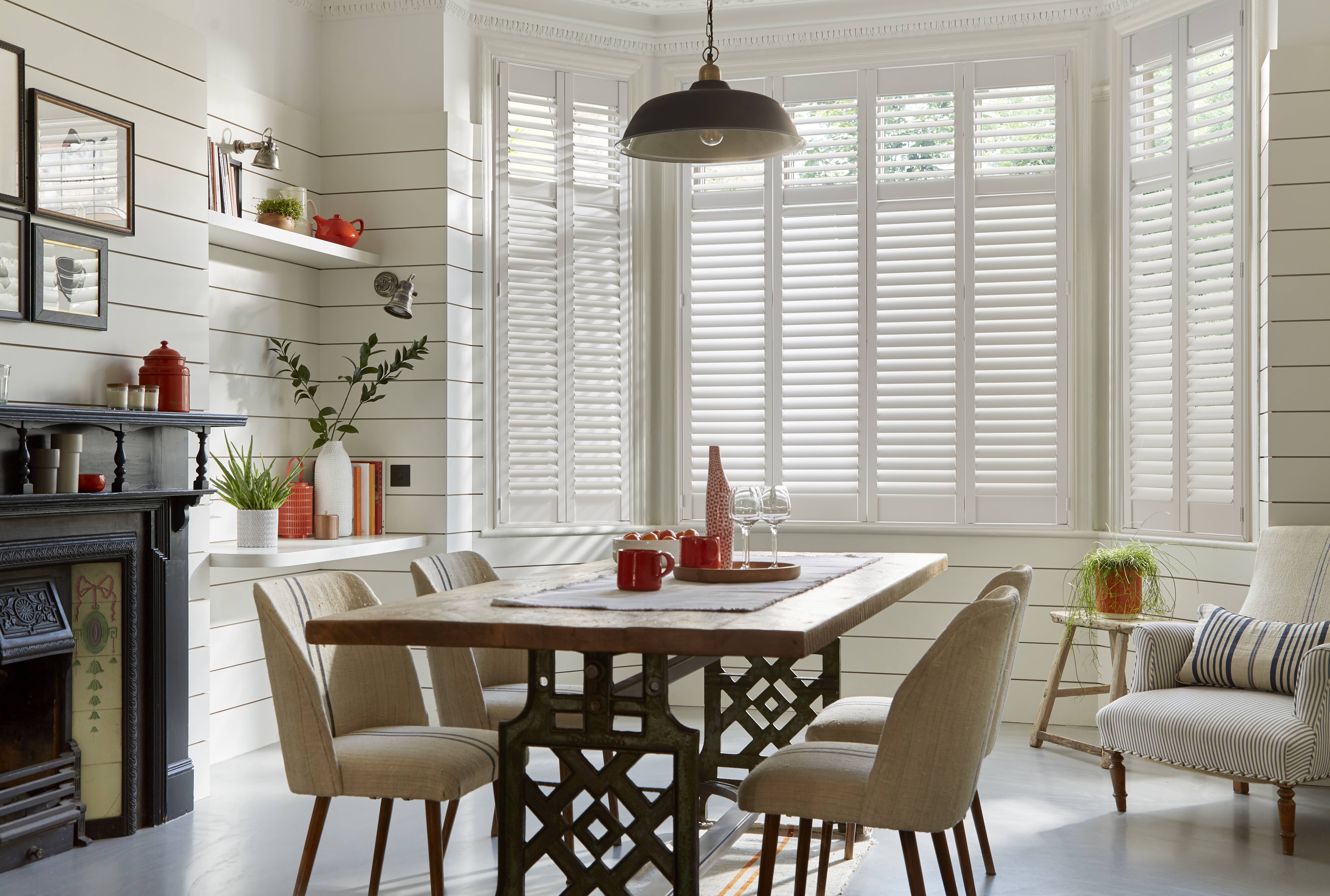 Made to measure shutters installed for natural light into a dining room