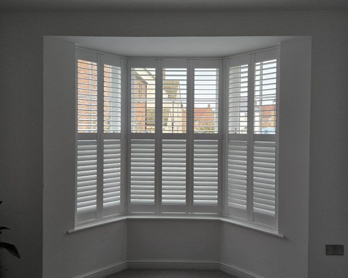 Modern white shutters in a kitchen with positive customer review